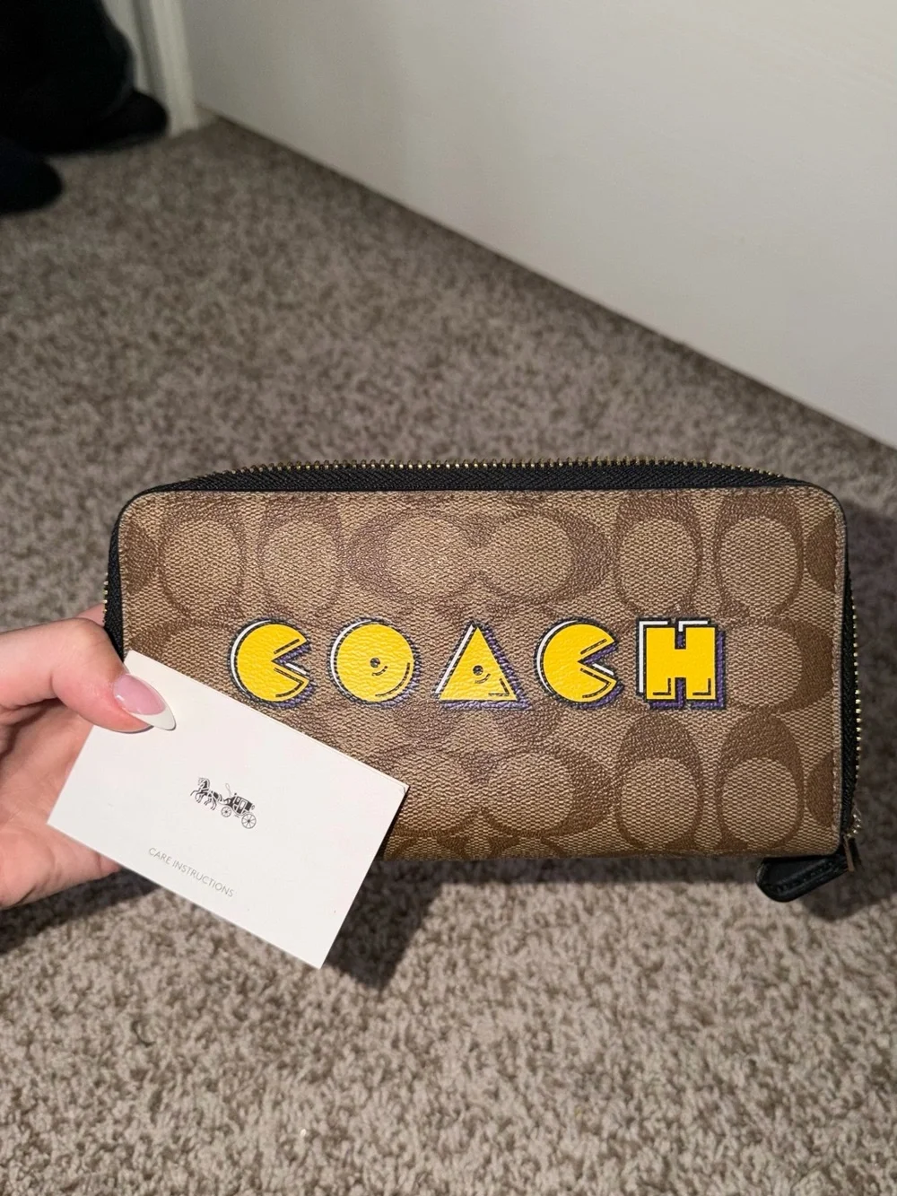 Coach Brown Signature Zip Wallet with Yellow Logo Patch